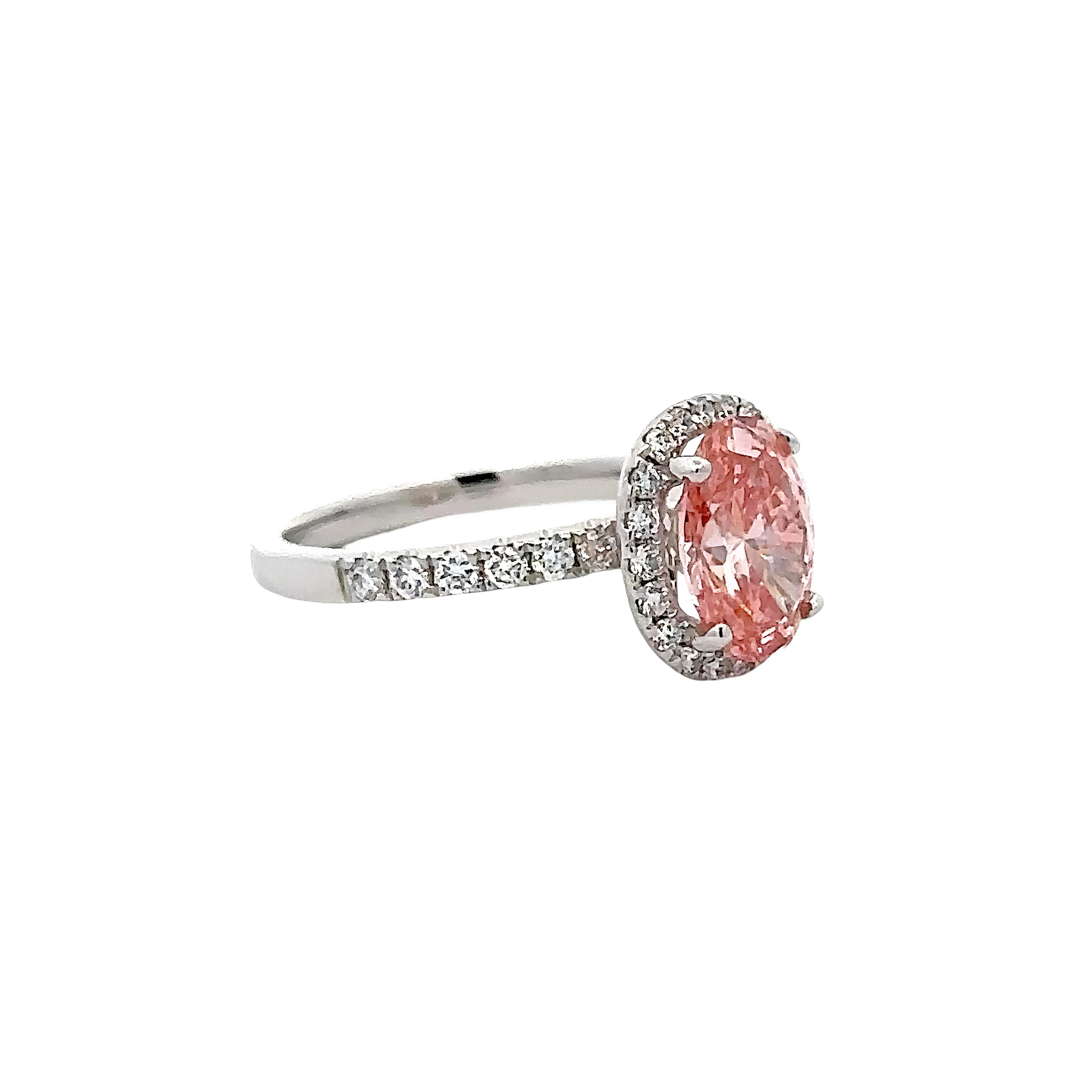 18K PINK DIAMOND OVAL CUT CENTRE STONE IN A HALO SETTING IN A 18K DIAMOND ACCENTED BAND – 2.55 CTW