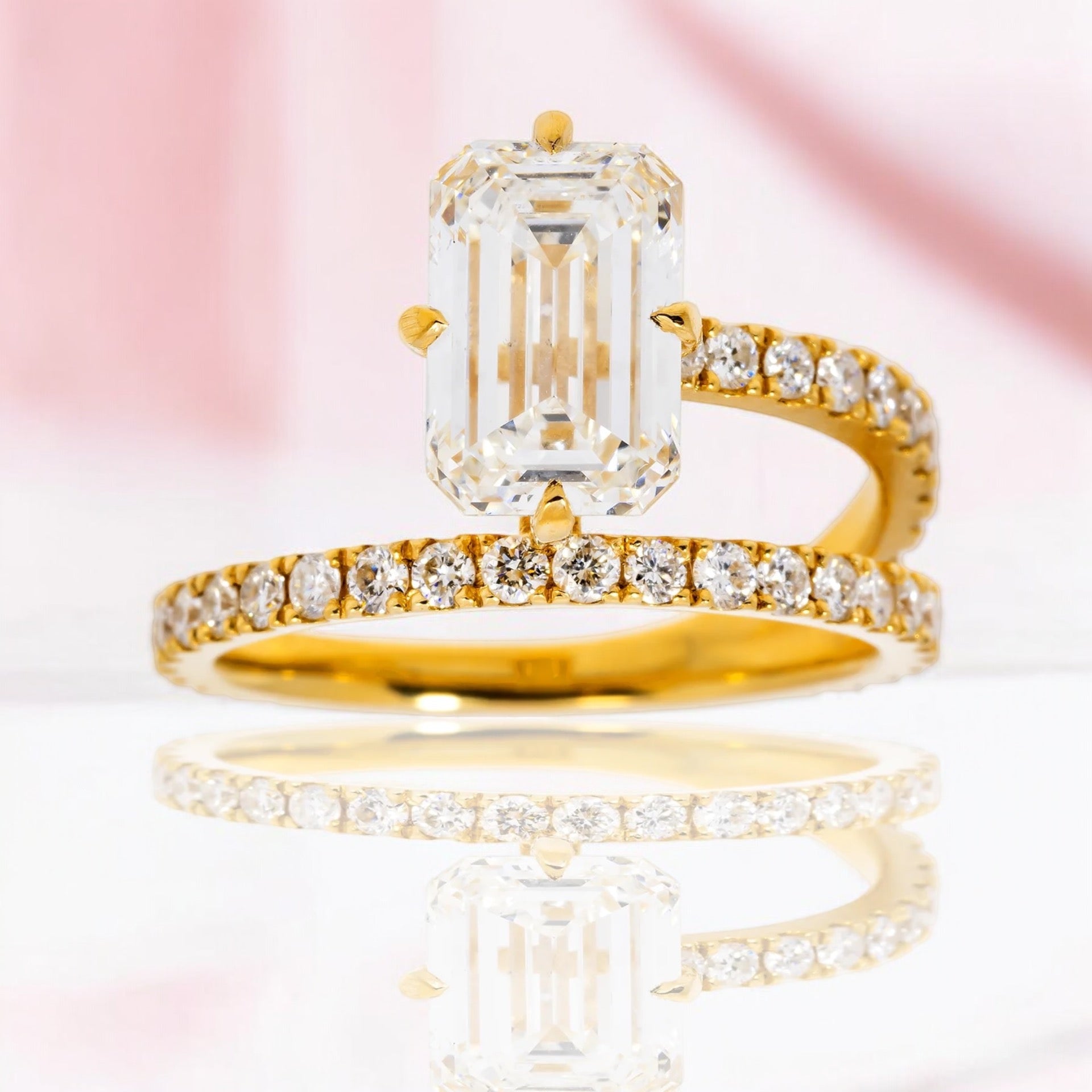 18K SOLITAIRE EMERALD CUT ENGAGEMENT RING IN A BYPASS SETTING - 2.41 CTW