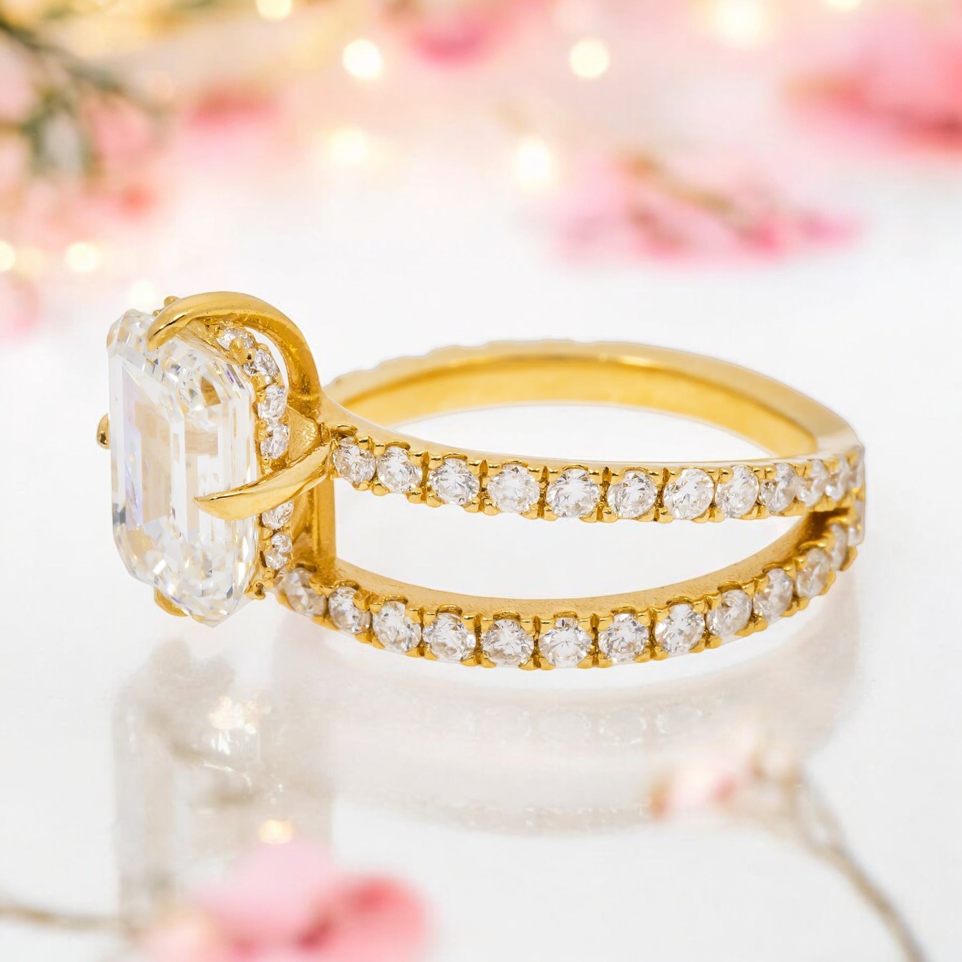 18K SOLITAIRE EMERALD CUT ENGAGEMENT RING IN A BYPASS SETTING - 2.41 CTW