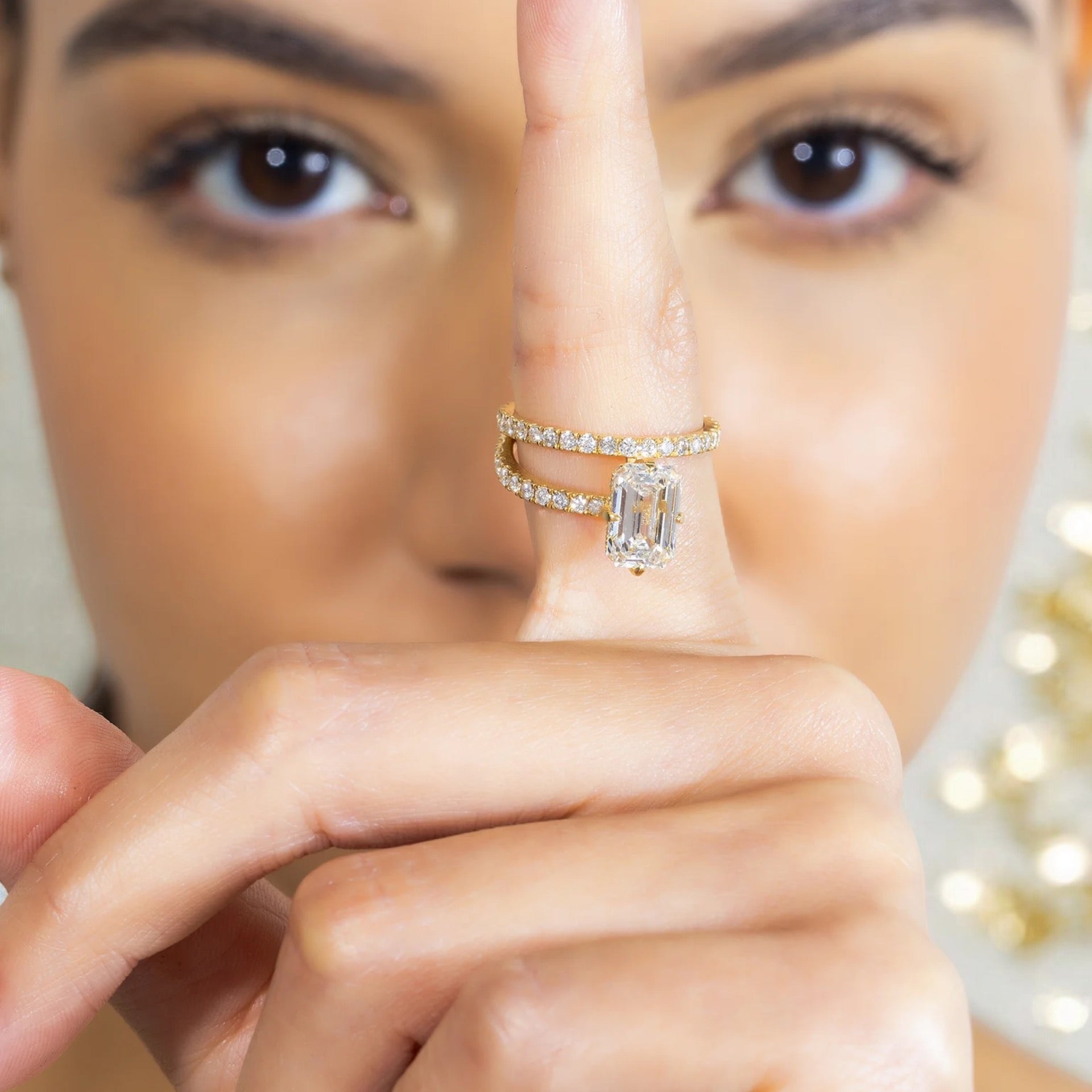 18K SOLITAIRE EMERALD CUT ENGAGEMENT RING IN A BYPASS SETTING - 2.41 CTW