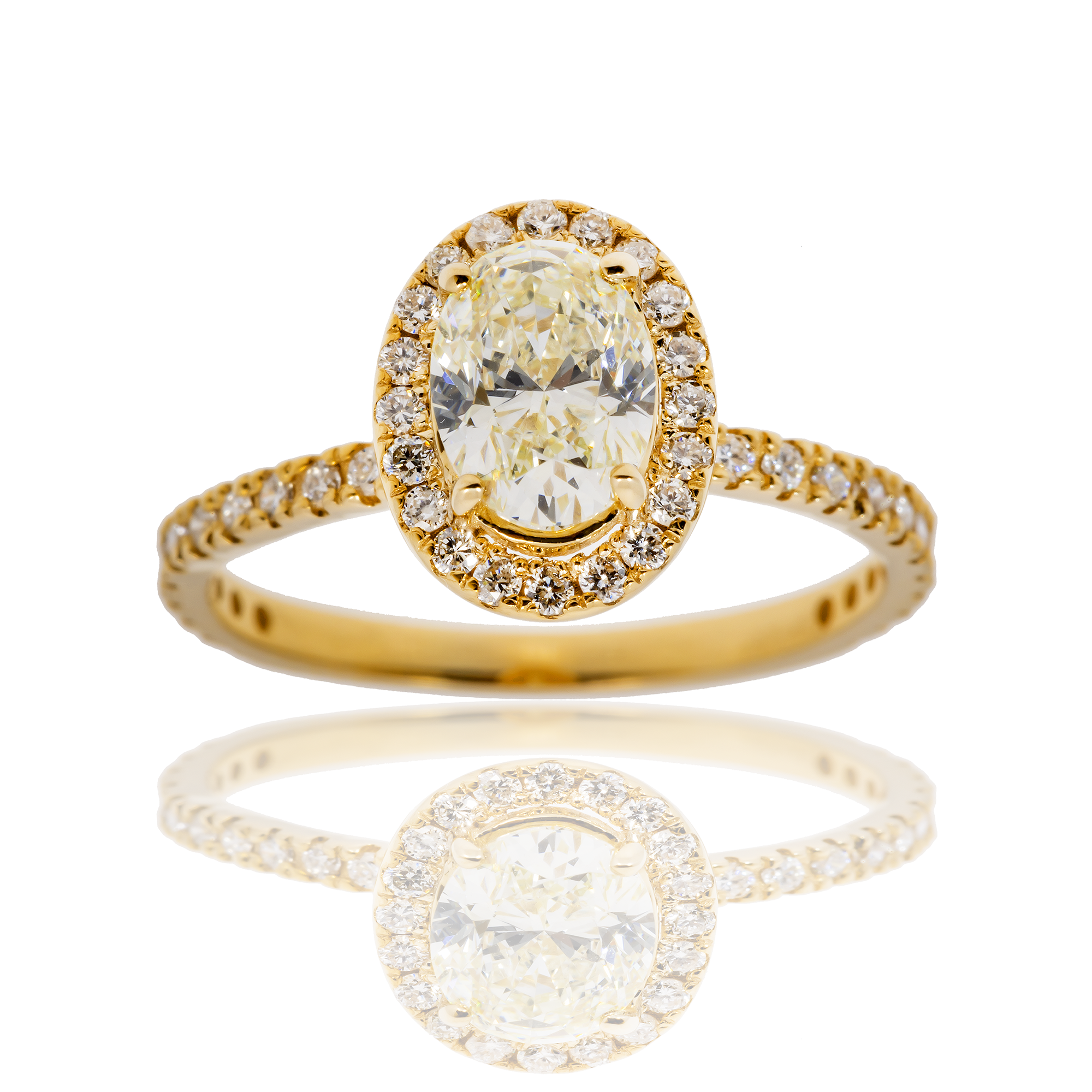 14K OVAL CUT CENTRE STONE IN A HALO SETTING IN A 14K DIAMOND ACCENTED BAND – 1.9 CTW
