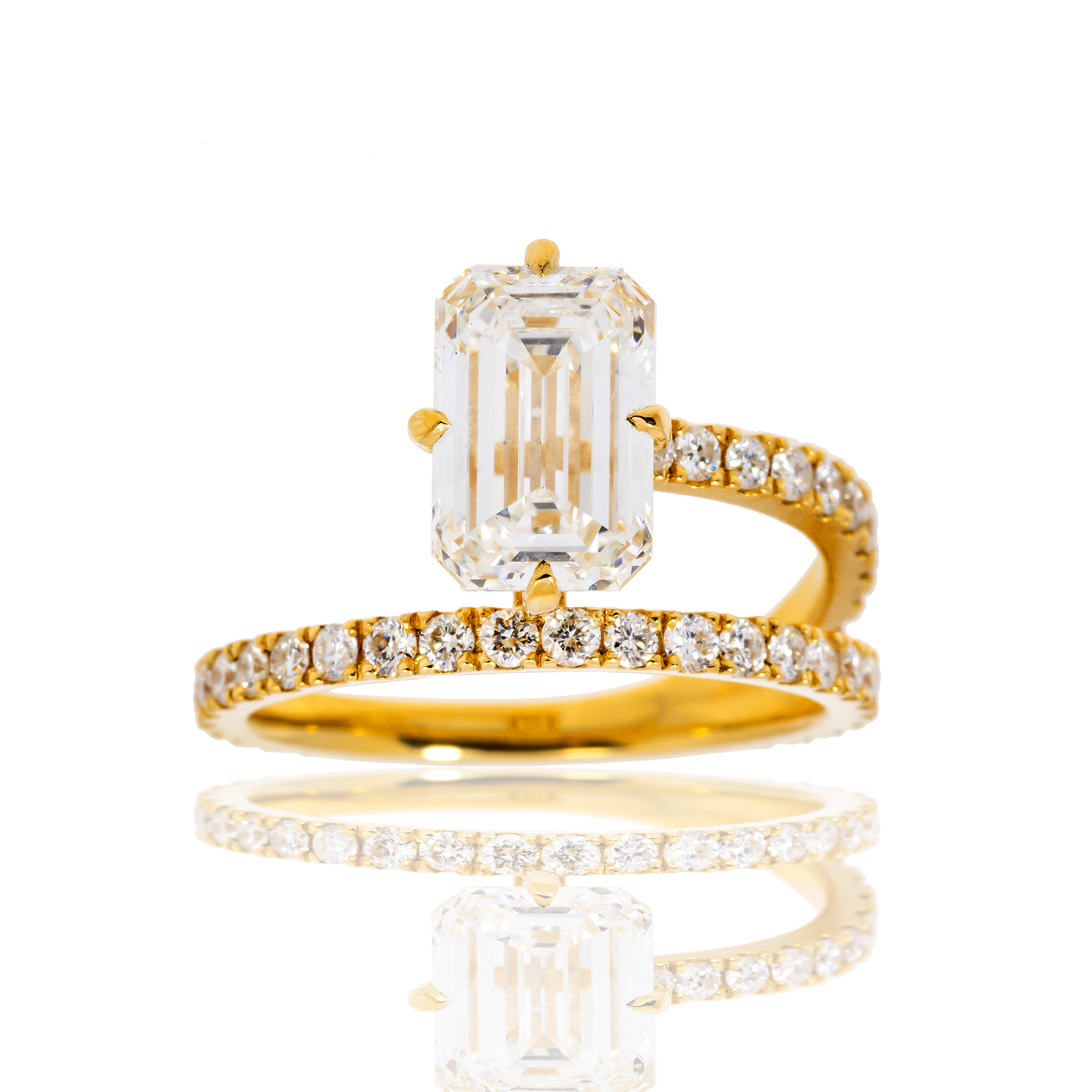 18K SOLITAIRE EMERALD CUT ENGAGEMENT RING IN A BYPASS SETTING - 2.41 CTW